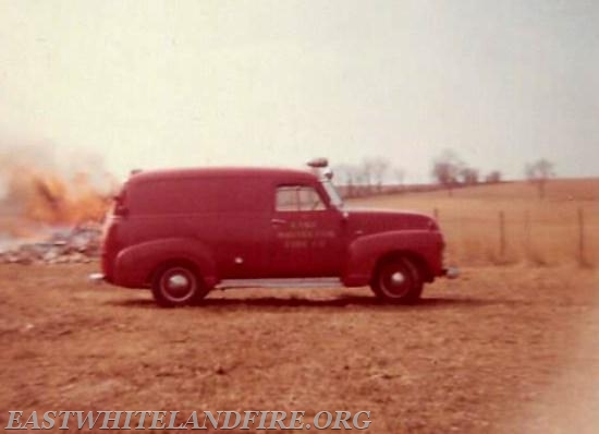 Chevrolet panel truck donated and painted red. Used to transport equipment and personnel.